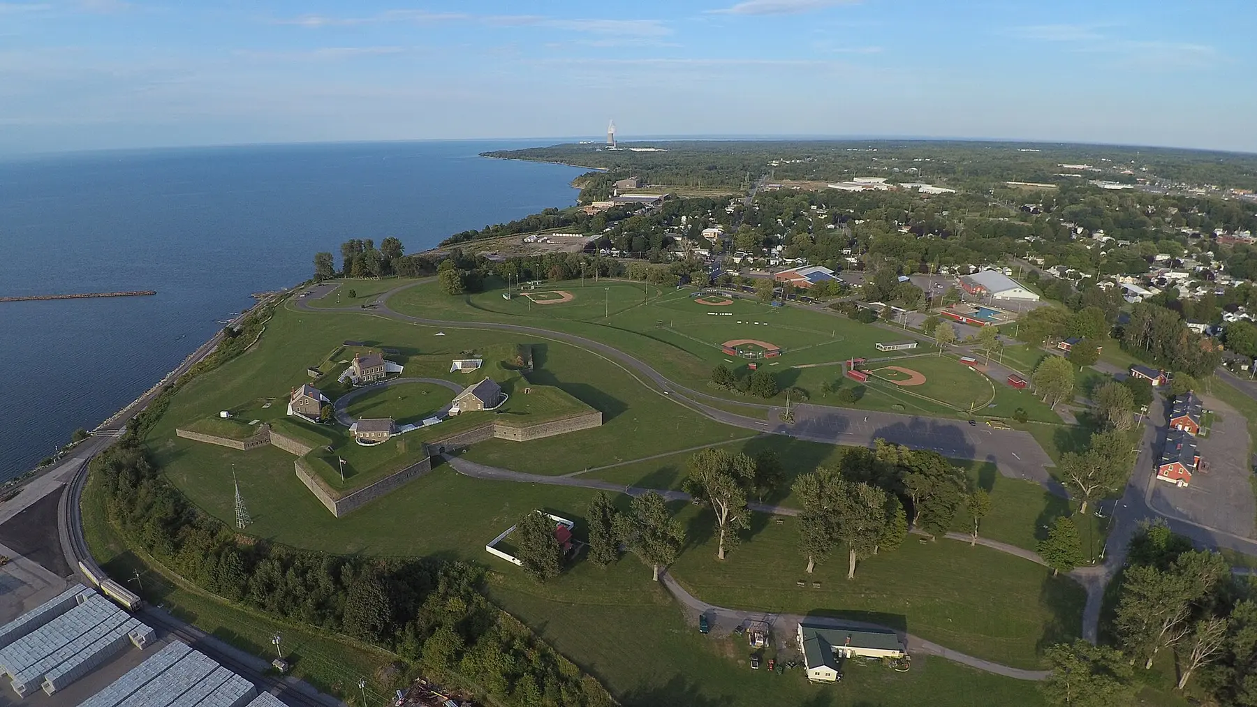 Aerial view of Fort Ontario's star-shaped stone fortifications beside Lake Ontario in Oswego