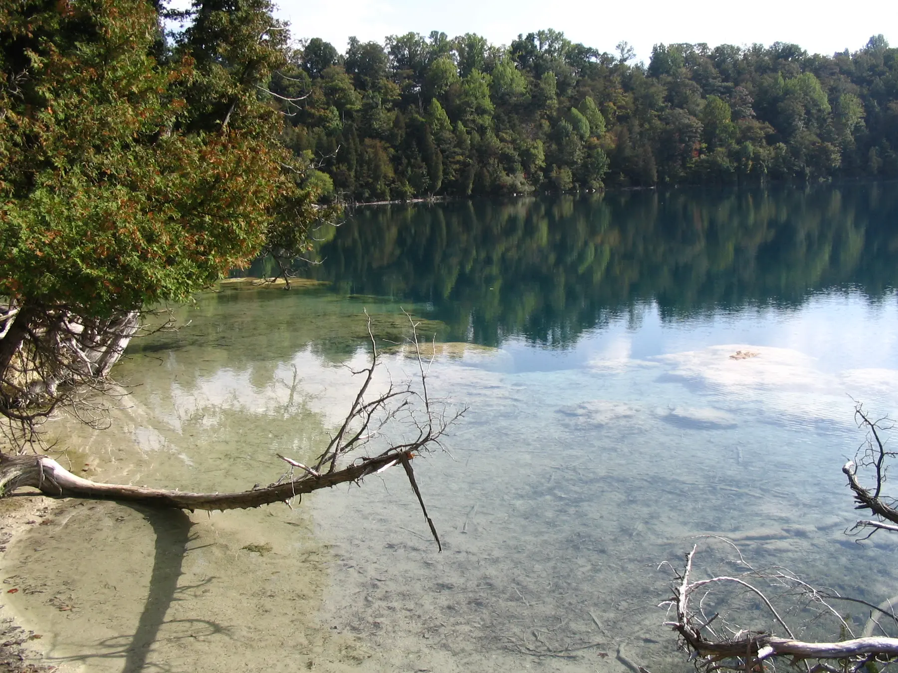 Clear green water and forest shoreline at Green Lakes State Park